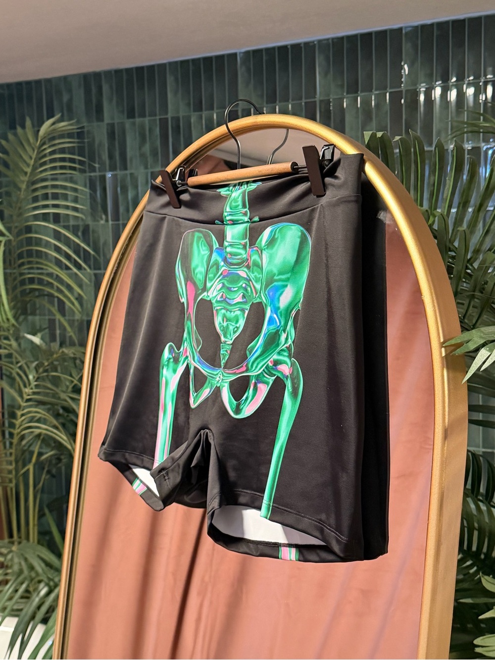 Men's Black Athletic Shorts with Iridescent Green Pelvis Graphic